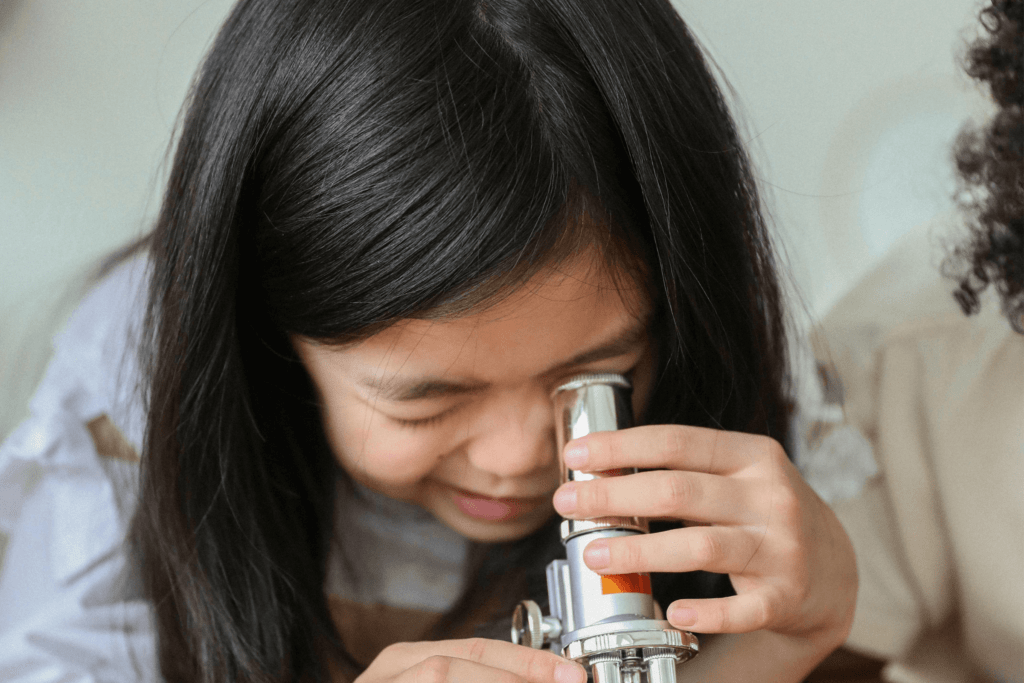 An image of a child exploring something is a key to develop grit.