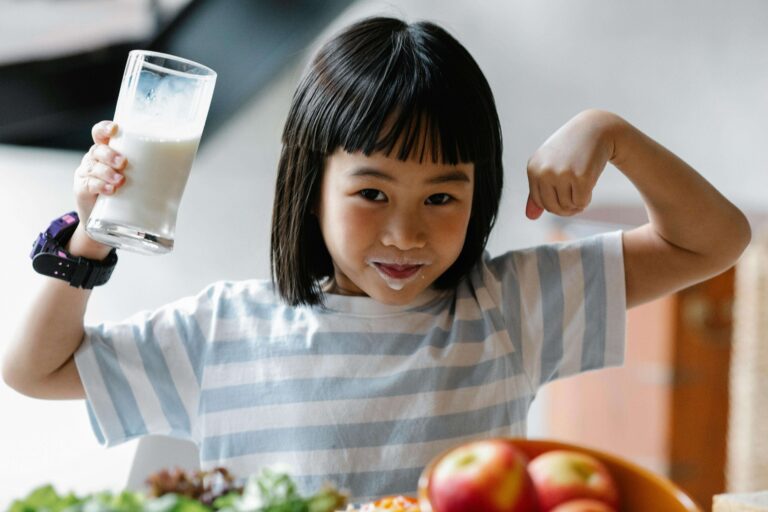 An image of a child drinking milk making good habits.