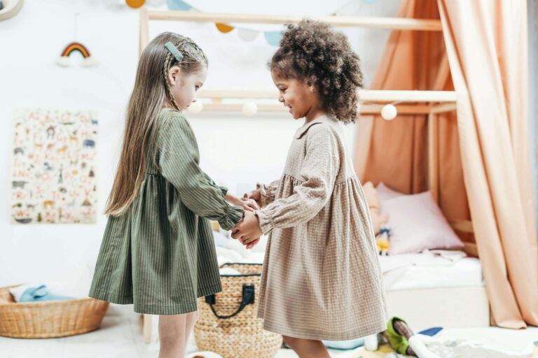 An image of two little girls are becoming friends because making friends is an essensial social skill.