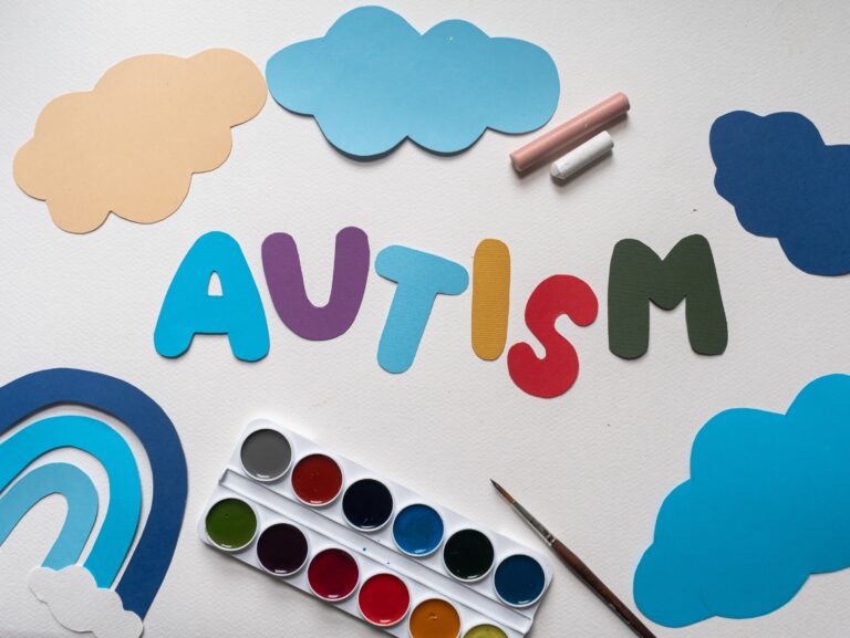 An images that represent s the word "Autism" with paper art. To compare autism and speech delay.