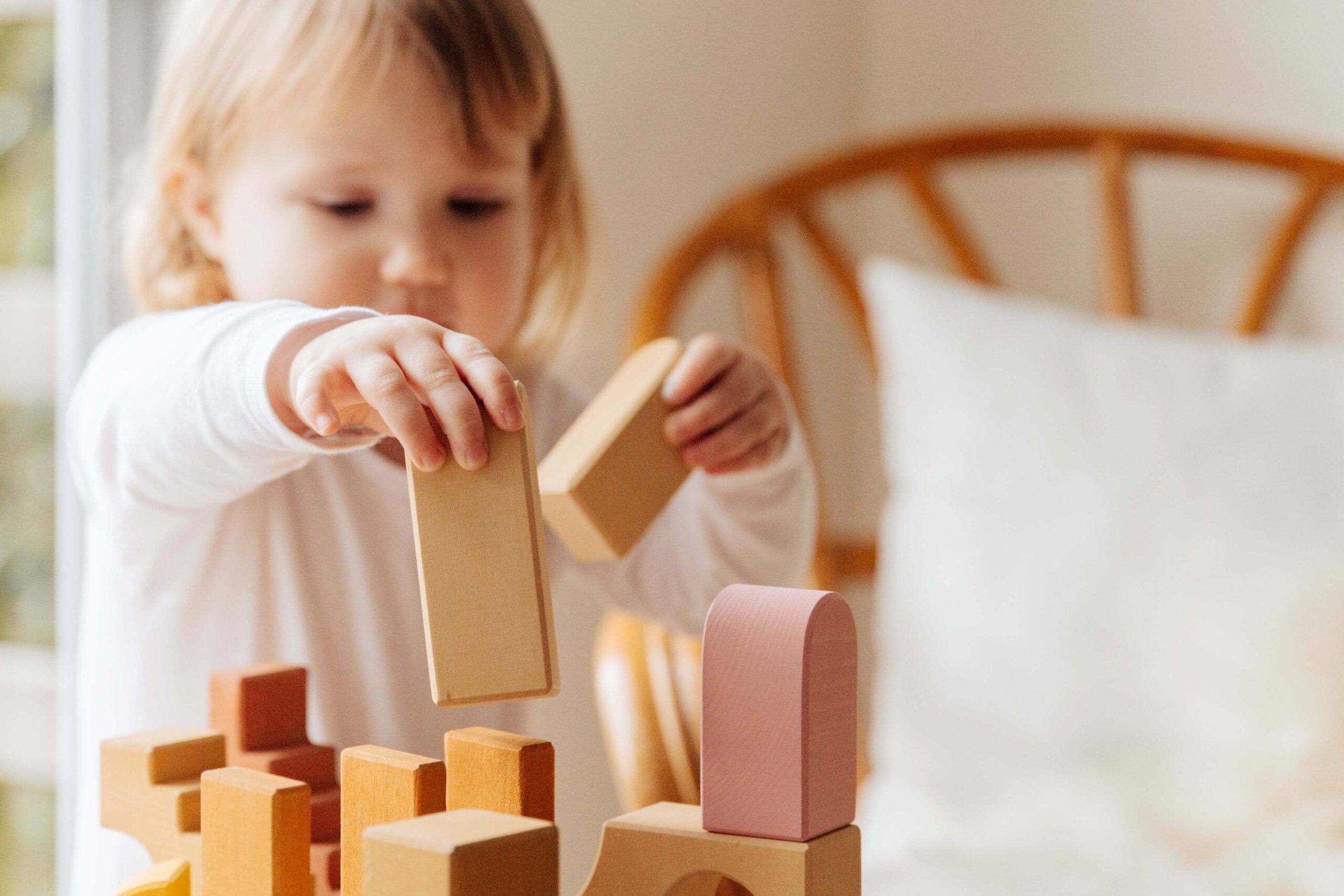 An image of a child playing with blocks. It nurture creativity in children.