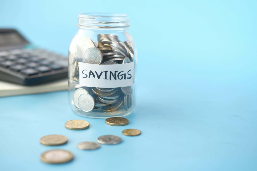 A glass jar with coins. Saving in transparent jar encourages a child and is a good money making habits.