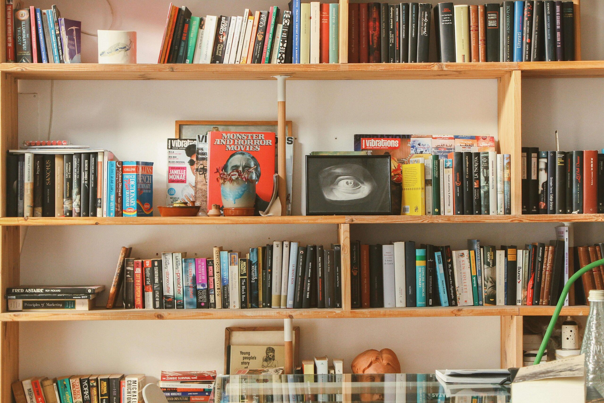 An image of books on parenting organized in a book rack.