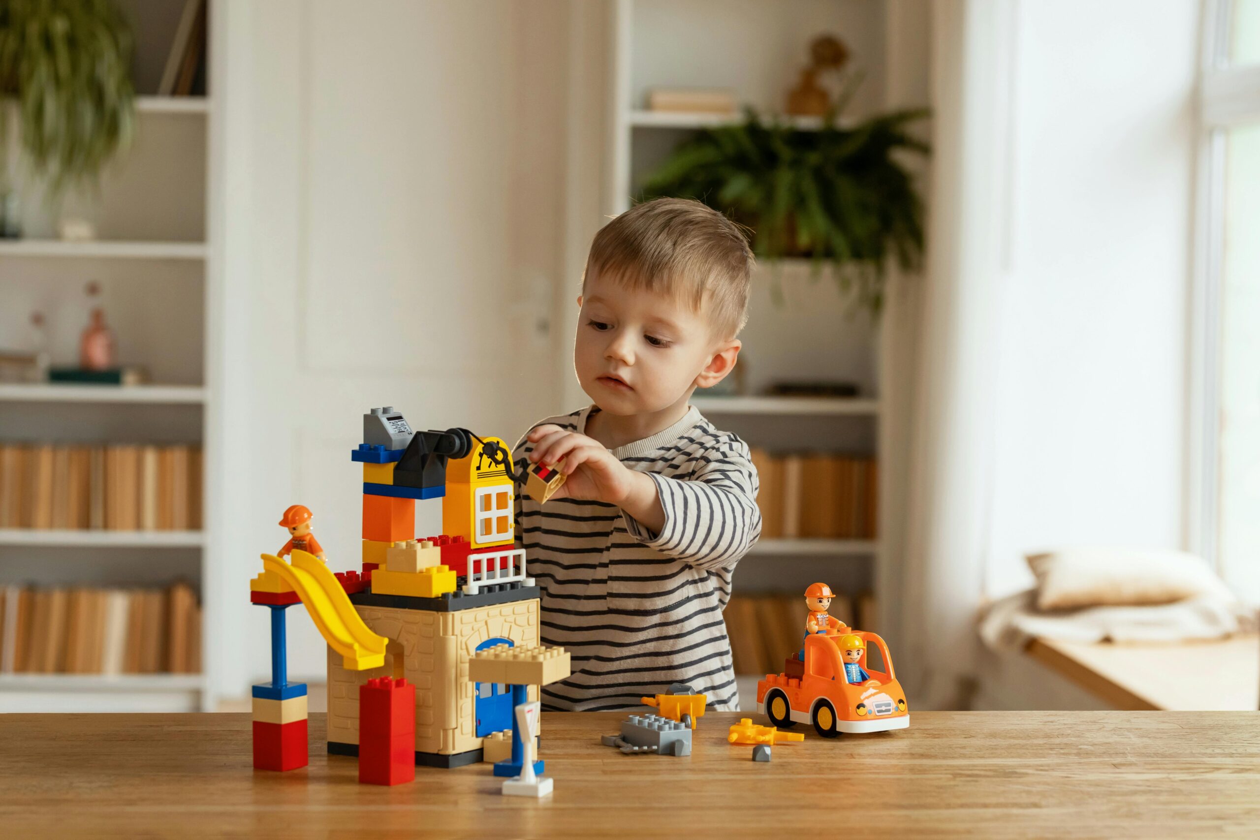 image of a child playing with wooden toys and having fun.