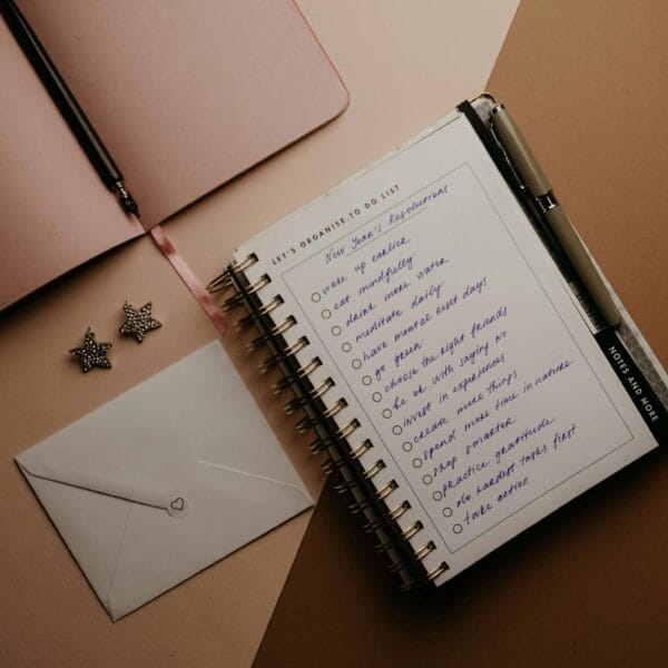 An image of journals and an envelop is placed on a table.